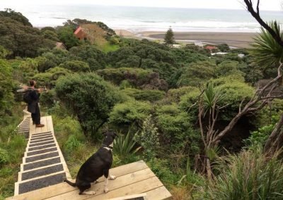 Piha gardener overlooking the gardens after a day of garden maintenance